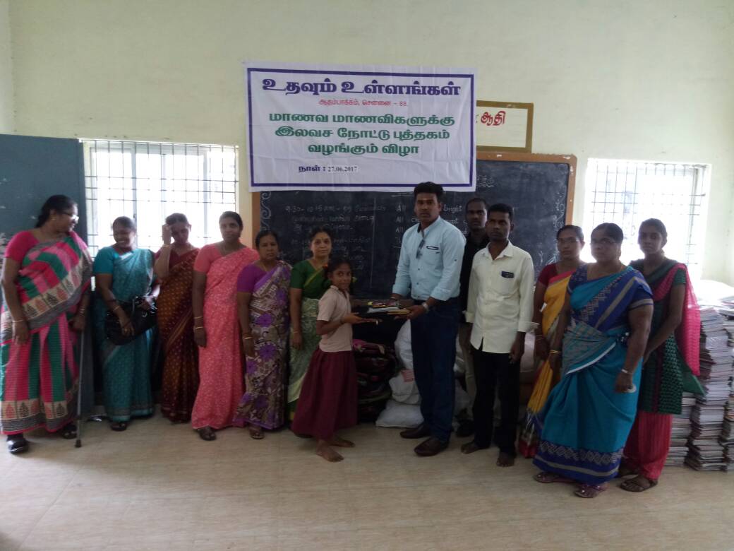 Poor school students at Adambakkam are donated with school aids